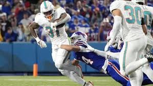 temp_image_1763305644.254223 Ollie Gordon Injury Update: Dolphins RB Limps Off Field in Week 11 Clash vs. Commanders