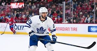 temp_image_1773186124.076503 Benoit-Olivier Groulx Called Up by Toronto Maple Leafs, Barkov Returns to Practice & More NHL Updates