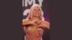 temp_image_1776060609.59325 Karol G: Balancing Stardom and Advocacy Amidst ICE Controversy