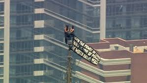 temp_image_1782926760.284594 Love at New Heights: Daring Couple Scales the Empire State Building for Peace