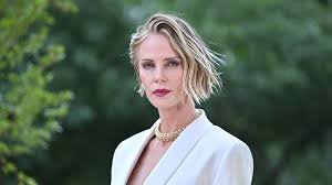 temp_image_1784165059.758497 Charlize Theron and Daughters August and Jackson Steal the Spotlight at 'The Odyssey' Premiere
